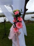 Pink gerberas decoration on wedding gazebo